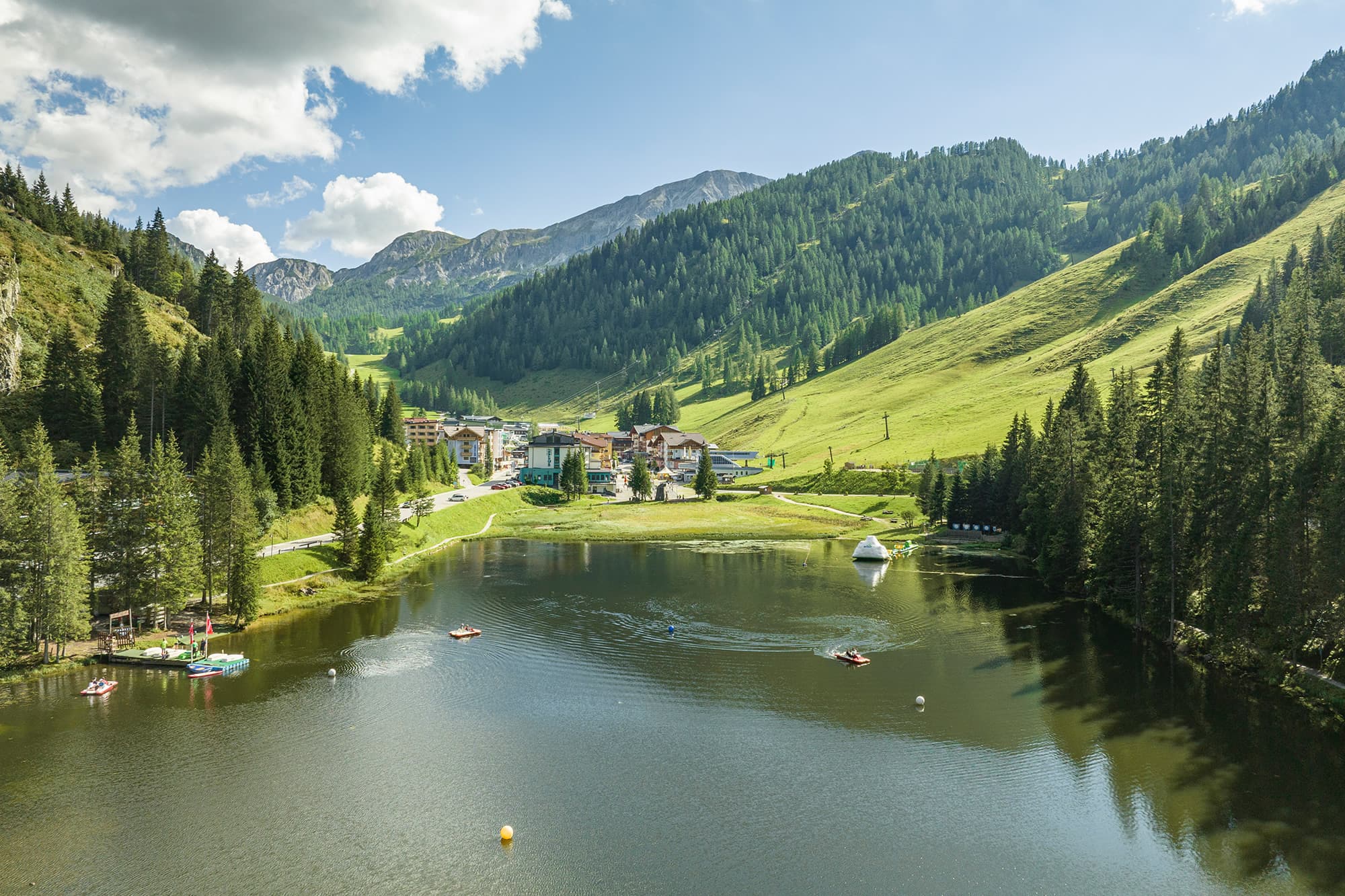 Summer holiday in Zauchensee in the Salzburger Land, surrounded by beautiful nature and a lake.