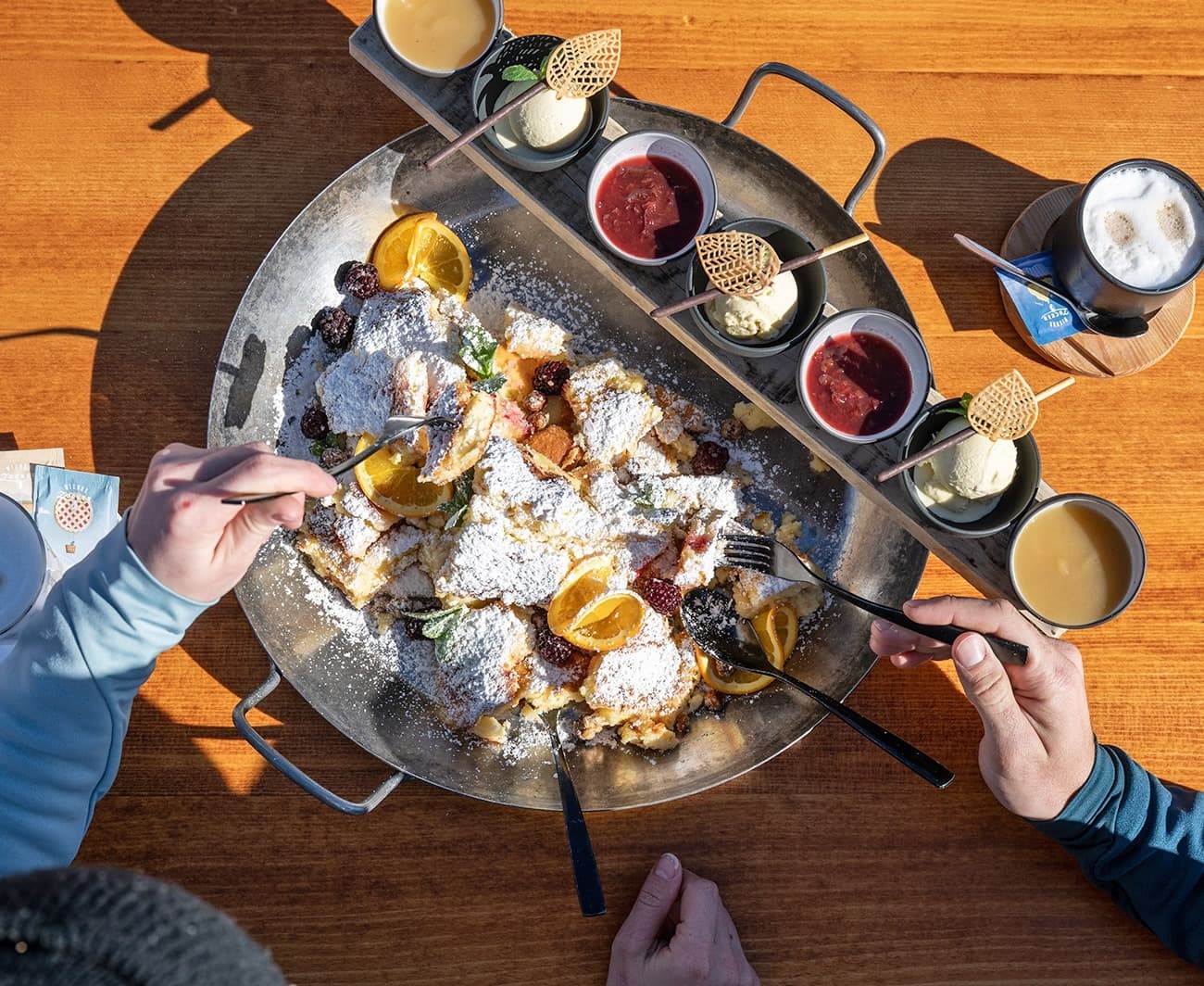 Eating Kaiserschmarrn at a ski hut during sunny skiing