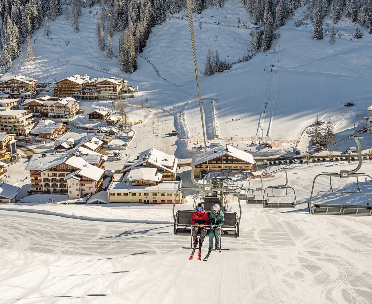 Skiing in the chairlift during a ski holiday in Zauchensee directly on the slope